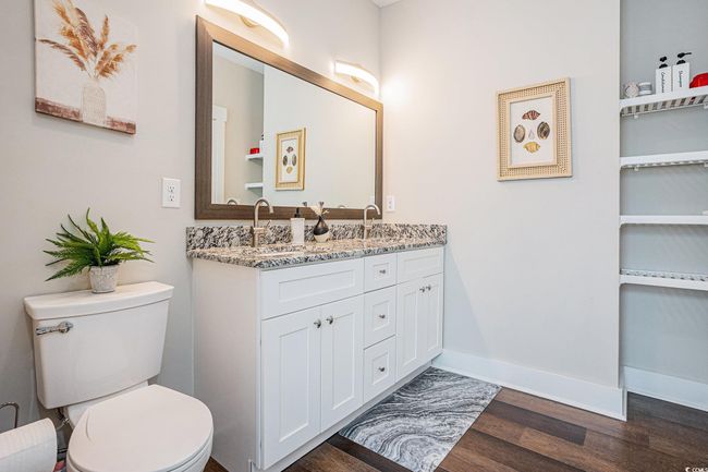 Bathroom featuring wood finished floors and double vanity | Image 14