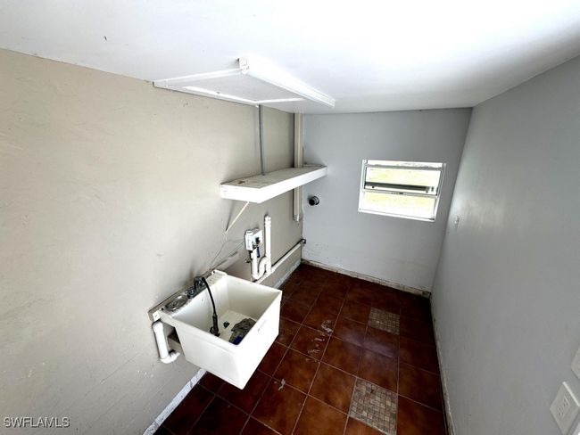 Washroom with tile patterned floors and laundry area | Image 15