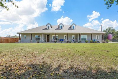 Front view of house with a yard | Image 1