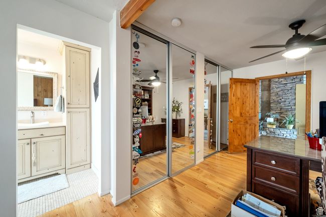 Interior space featuring a sink and light wood-style flooring | Image 15