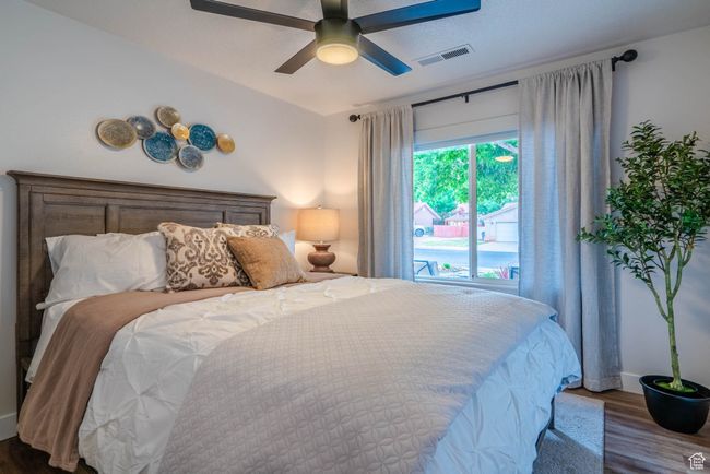 Bedroom with ceiling fan and dark hardwood / wood-style flooring | Image 41