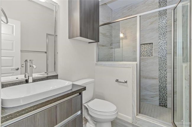 Full bath with vanity and a stall shower | Image 9