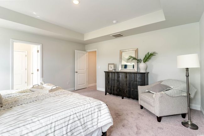 Bedroom featuring baseboards and light carpet | Image 17