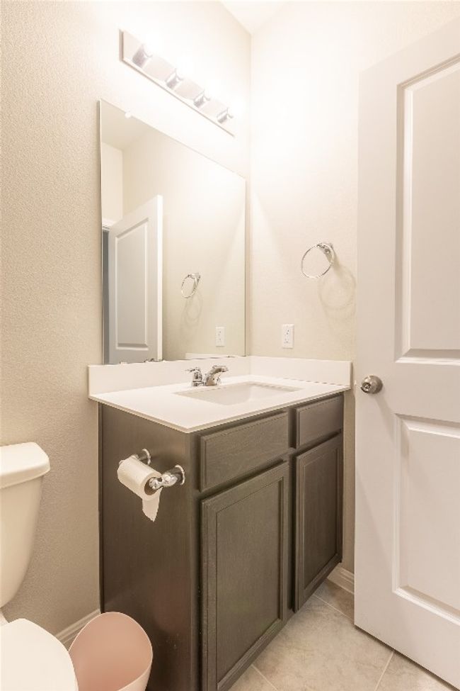 Bathroom featuring tile patterned floors, toilet, and vanity | Image 22