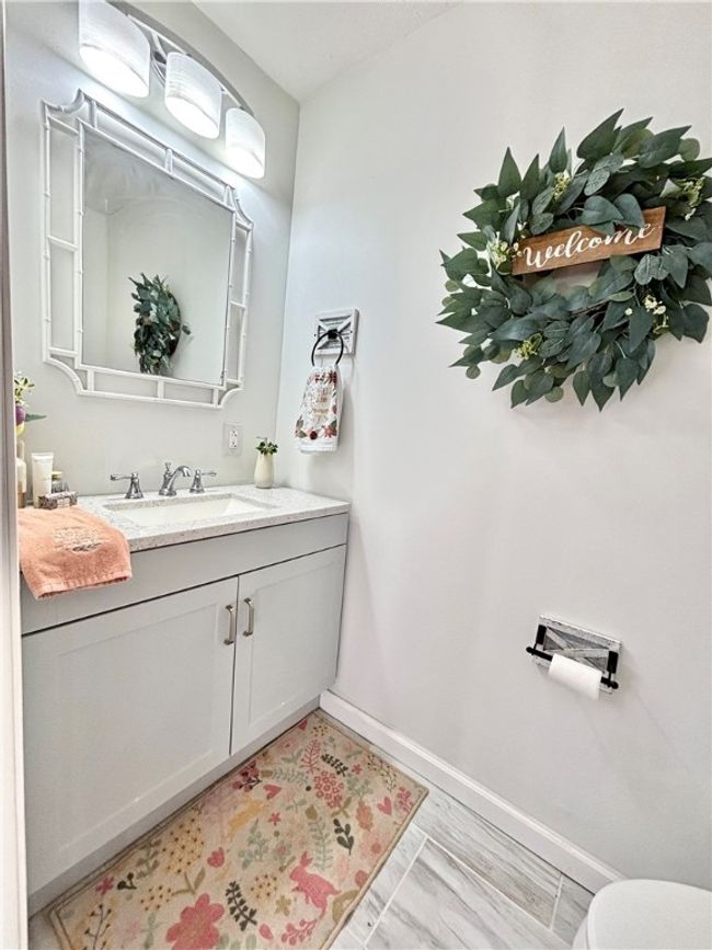 New first floor powder room serves guests in comfort | Image 30