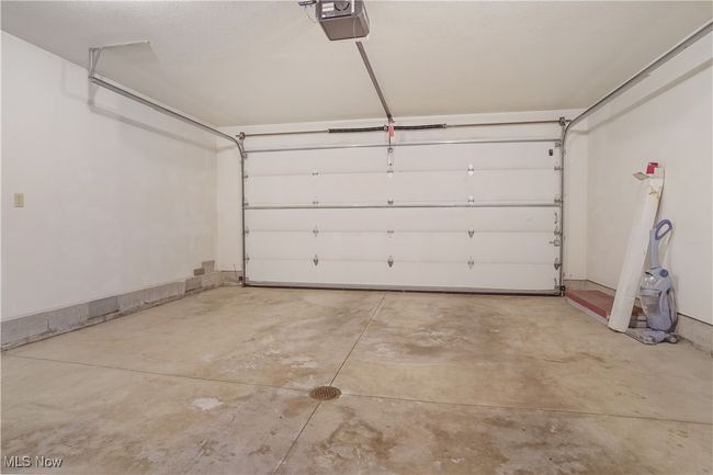 Garage with a garage door opener | Image 22