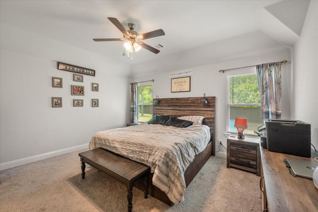 Bedroom featuring carpet and ceiling fan | Image 19