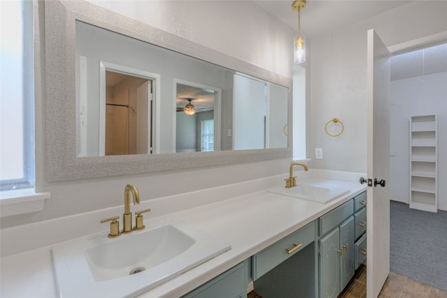 Full bathroom featuring double vanity and ceiling fan | Image 19