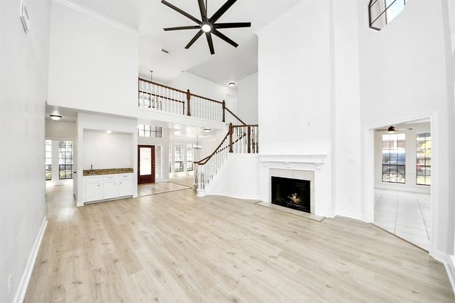 Gorgeous double tall living area with fireplace. | Image 5