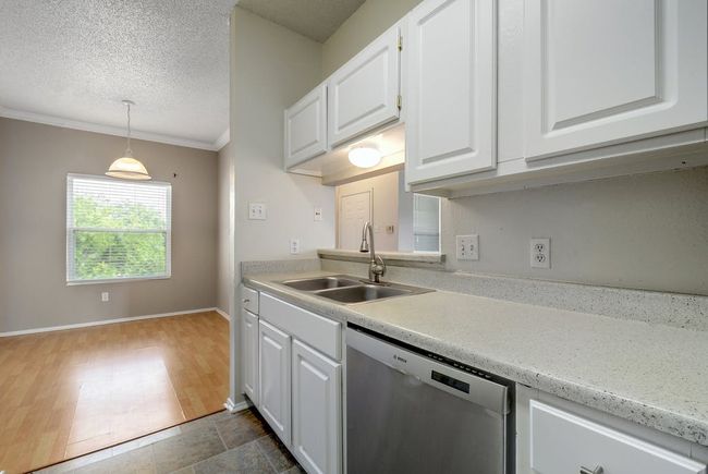View from the kitchen into the dining area. | Image 9