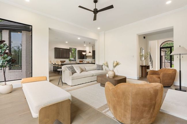 Seamlessly connected to the kitchen and dining areas, this living space makes hosting guests or spending time with family effortless. | Image 7