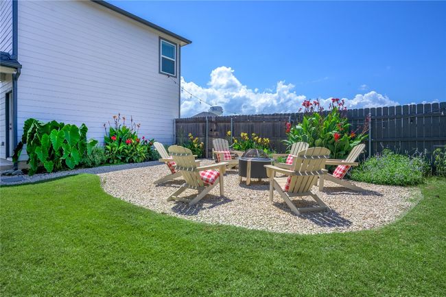 View of yard with an outdoor fire pit | Image 20