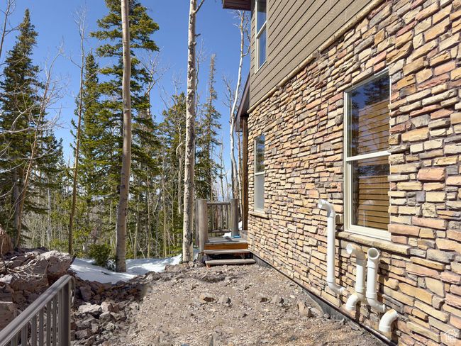 View of property exterior featuring stone siding | Image 52