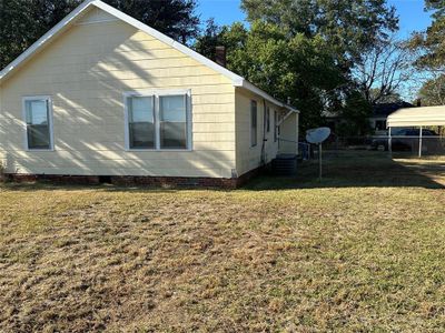 View of property exterior featuring a yard | Image 2