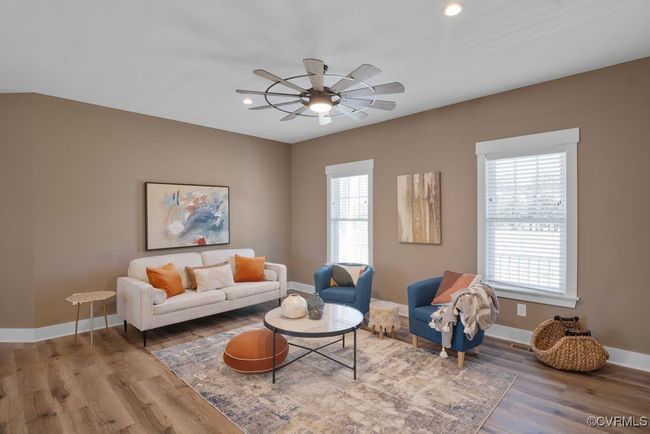 Living area featuring ceiling fan, recessed lighting, wood finished floors, and baseboards | Image 4