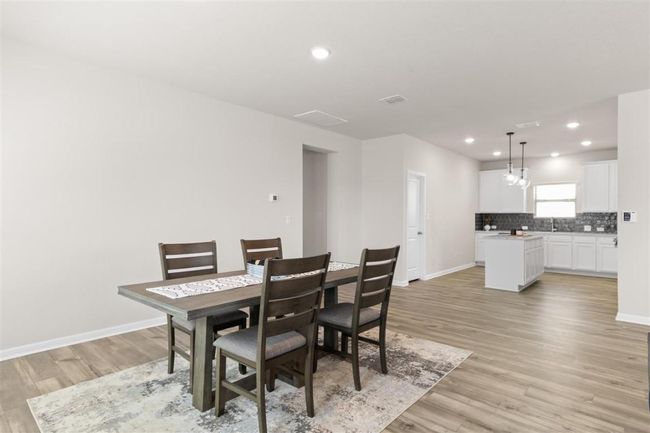 Dining area with baseboards, recessed lighting, and light wood-style floors | Image 13