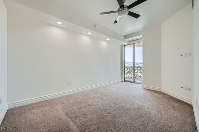 Carpeted spare room with baseboards, a ceiling fan, recessed lighting, and expansive windows | Image 22