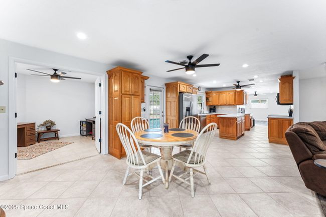 Kitchen and 6th bedroom/flex room to the left | Image 11