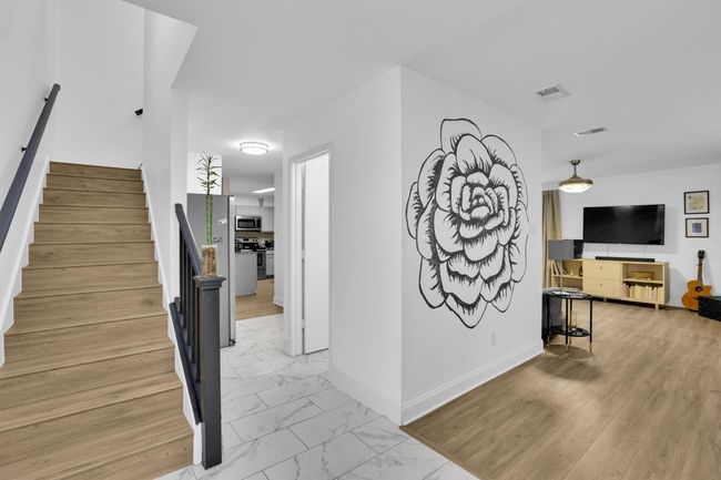 Corridor featuring light marble finish flooring and stairs | Image 4