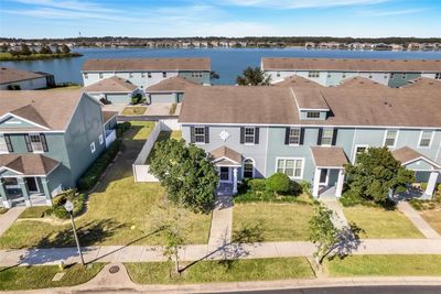 Corner unit townhome with a private fenced back yard and lake view! | Image 1