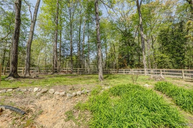 Partially fenced yard | Image 47