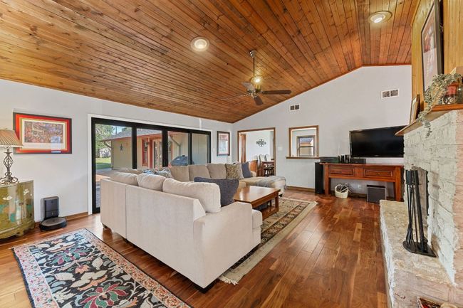 The vaulted wood ceiling is stunning and goes seamlessly with the wood floors. | Image 4