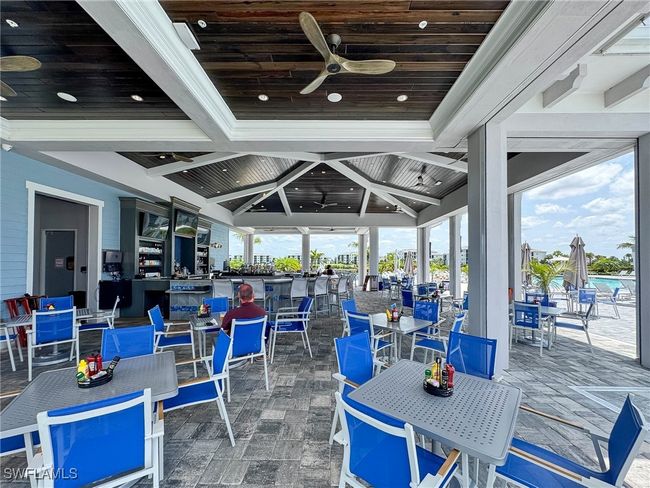 View of patio / terrace featuring a ceiling fan and outdoor dining area | Image 44