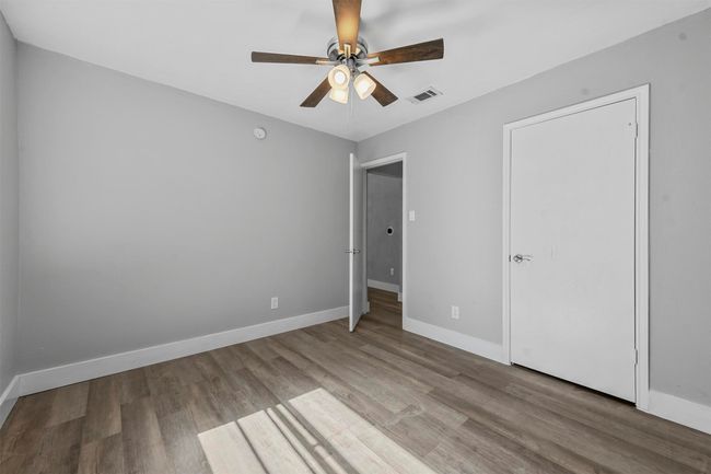 Unfurnished bedroom with ceiling fan and light hardwood / wood-style flooring | Image 26