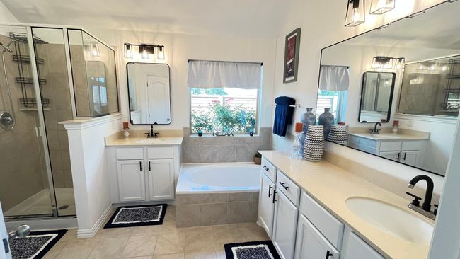 Full bathroom with tile patterned flooring, healthy amount of natural light, and a shower stall | Image 20