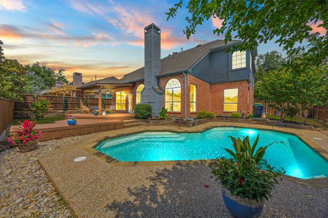 Pool at dusk with large coolcrete area for seating including the covered deck! | Image 39