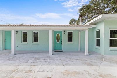 front of home with large patio | Image 1