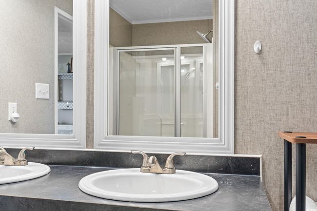 Bathroom with double vanity and a stall shower | Image 19