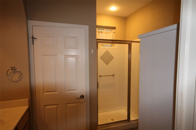 Full bath featuring a shower stall and vanity | Image 14