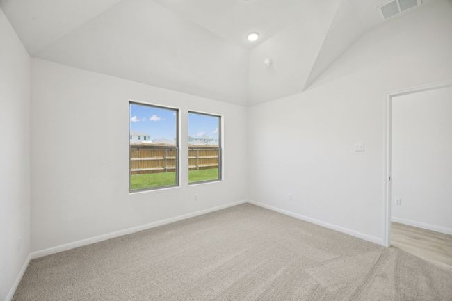 Unfurnished room with vaulted ceiling and light carpet | Image 20