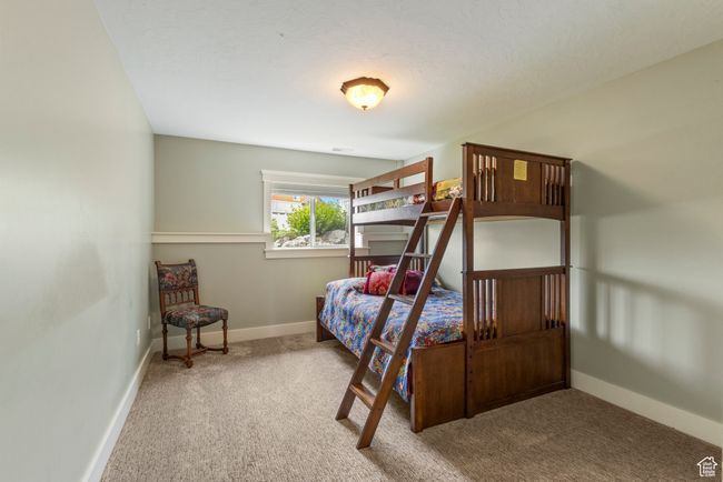 Bedroom featuring carpet floors and baseboards | Image 30