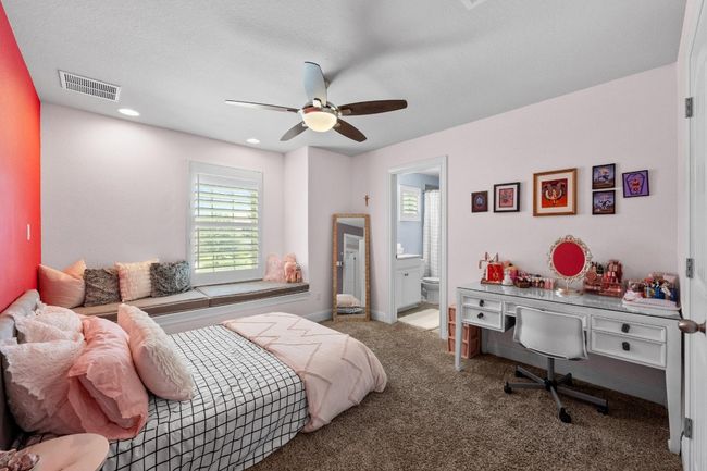 Carpeted bedroom with ensuite bathroom, a ceiling fan, and recessed lighting | Image 28