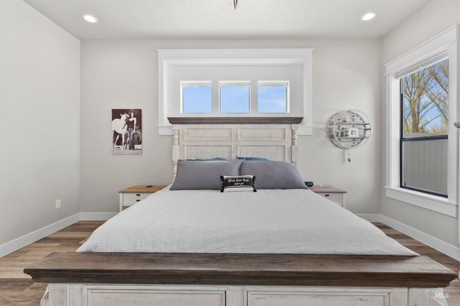 Bedroom featuring dark wood-style floors and recessed lighting | Image 23