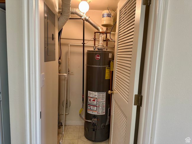 Utilities featuring gas water heater and electric panel | Image 25