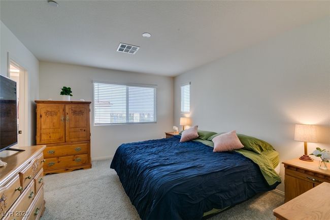 Bedroom featuring baseboards, visible vents, and carpet floors | Image 22