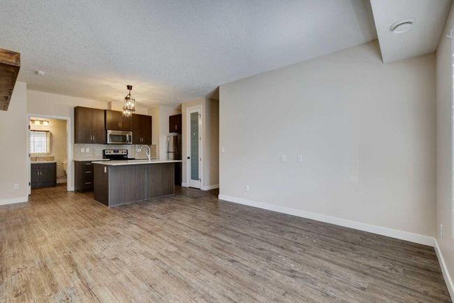 1411 - 2461 Baysprings Link Sw, Home with 2 bedrooms, 1 bathrooms and 1 parking in Airdrie AB | Image 2