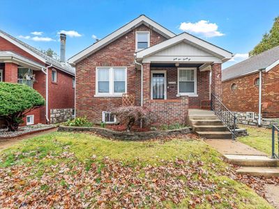 Bungalow-style home with a front yard | Image 1