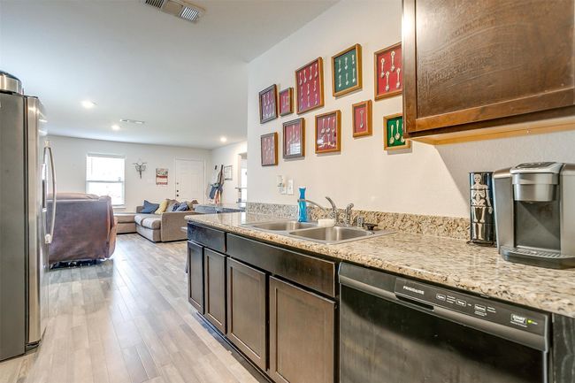 Kitchen featuring spacious countertops and cabinets | Image 15