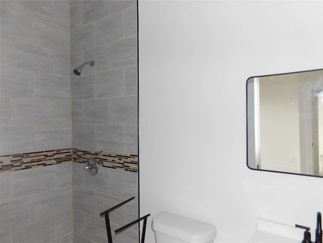 middle bedroom ceramic tile shower | Image 17