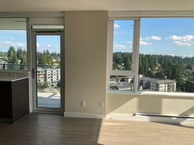 Interior space featuring wood finished floors, plenty of natural light, and baseboards | Image 5