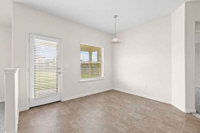 Spare room with baseboards | Image 23
