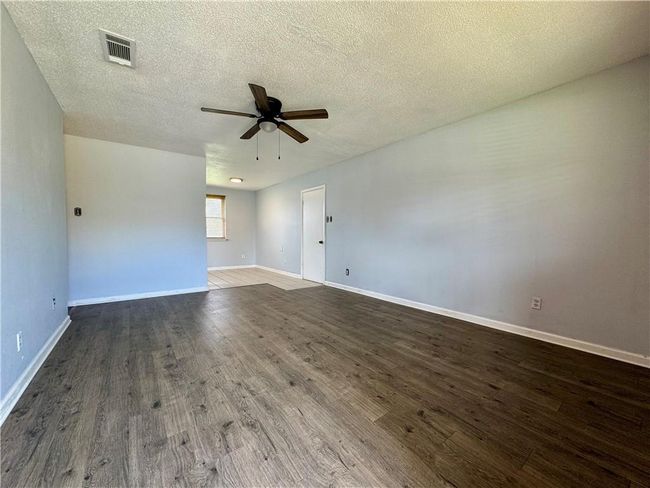 Your view of the living room from the front door | Image 5