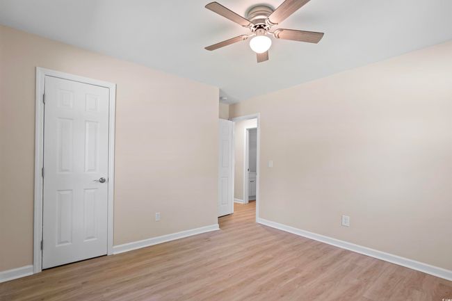 Unfurnished bedroom featuring light wood-style floors and ceiling fan | Image 28