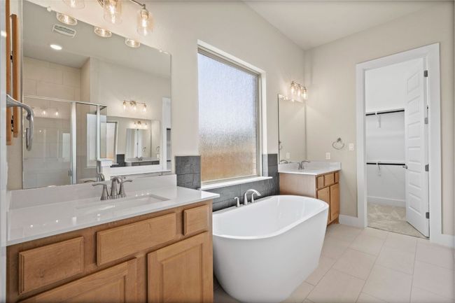 Primary Bath retreat with dual vanities & soaking tub | Image 22