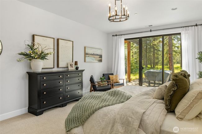 Primary bedroom with sliding glass to outdoor patio. | Image 23