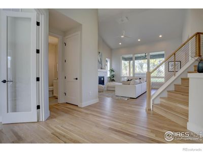 Vaulted ceilings and white oak flooring greet you in this open floor plan | Image 2